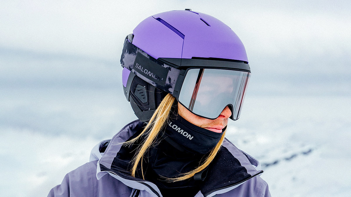 Man in purple salomon ski helmet